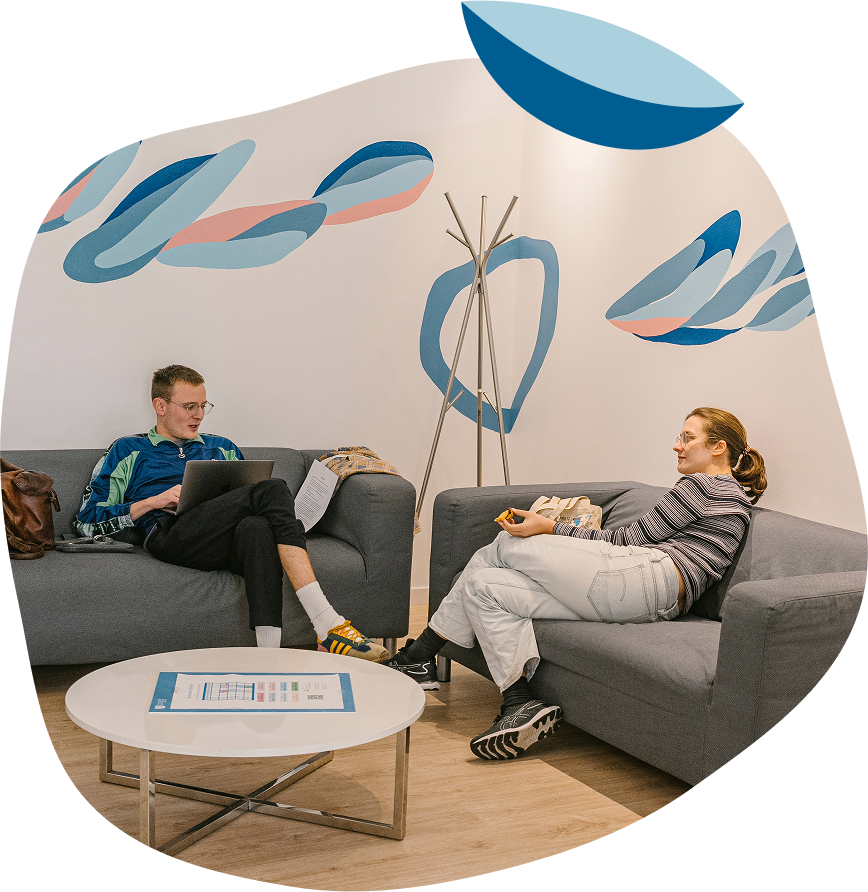 Students relaxing in common area at Lusa Language School while discussing Portuguese language learning