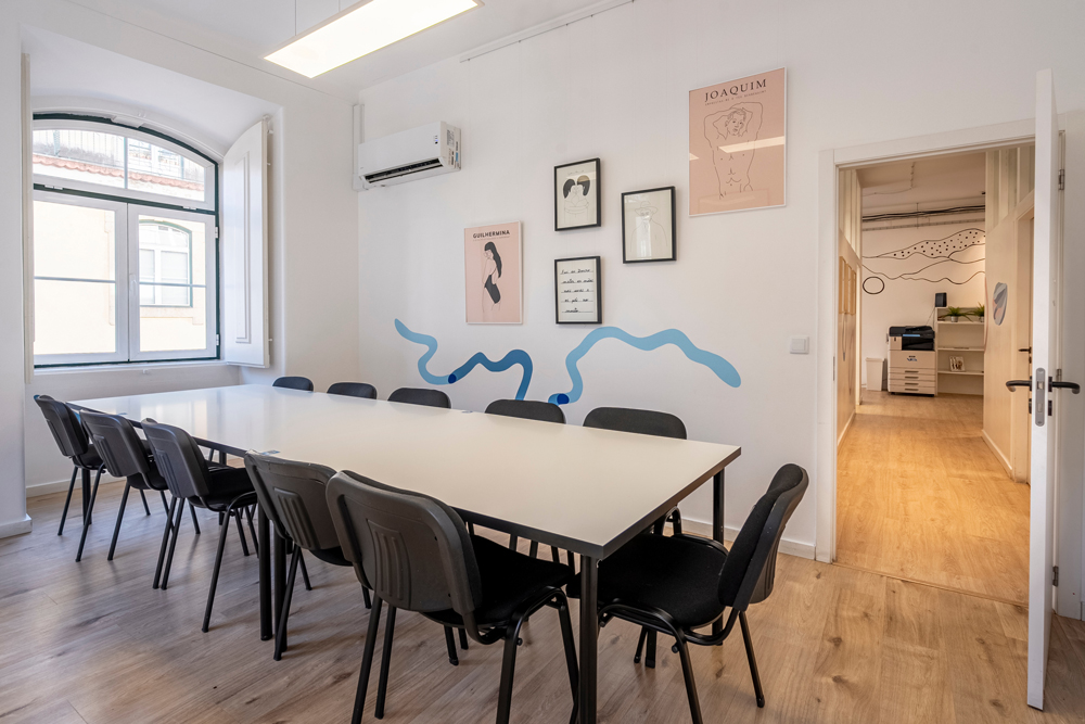 Classroom at Lusa Language School in Lisbon decorated with artwork, where foreigners learn Portuguese